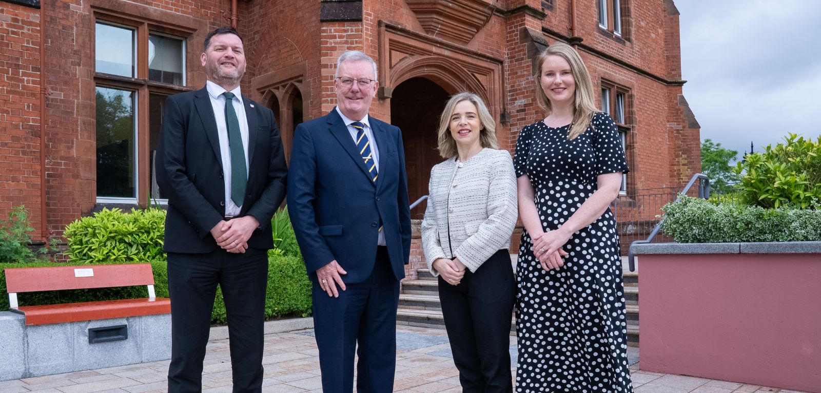 NI Health Minister pictured with Queen's University representatives